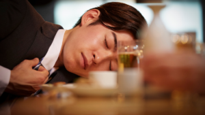 Furariimen - Japanese man in business suit lying face-down drunk on bar