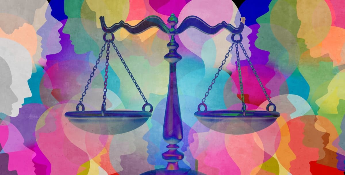 Scales of justice with faces in the background