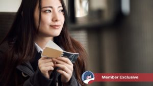 Woman studying vocabulary from flash cards