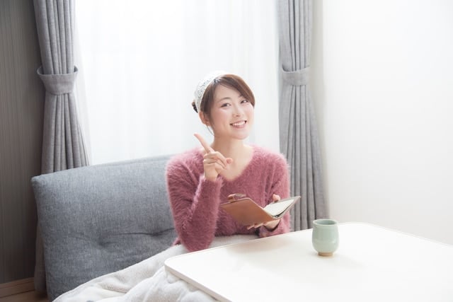 Woman under kotatsu