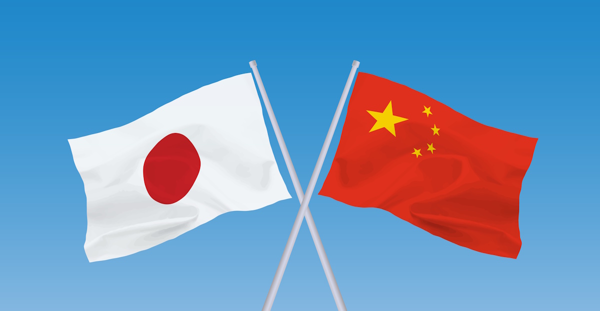 Japan and China flags against a blue background