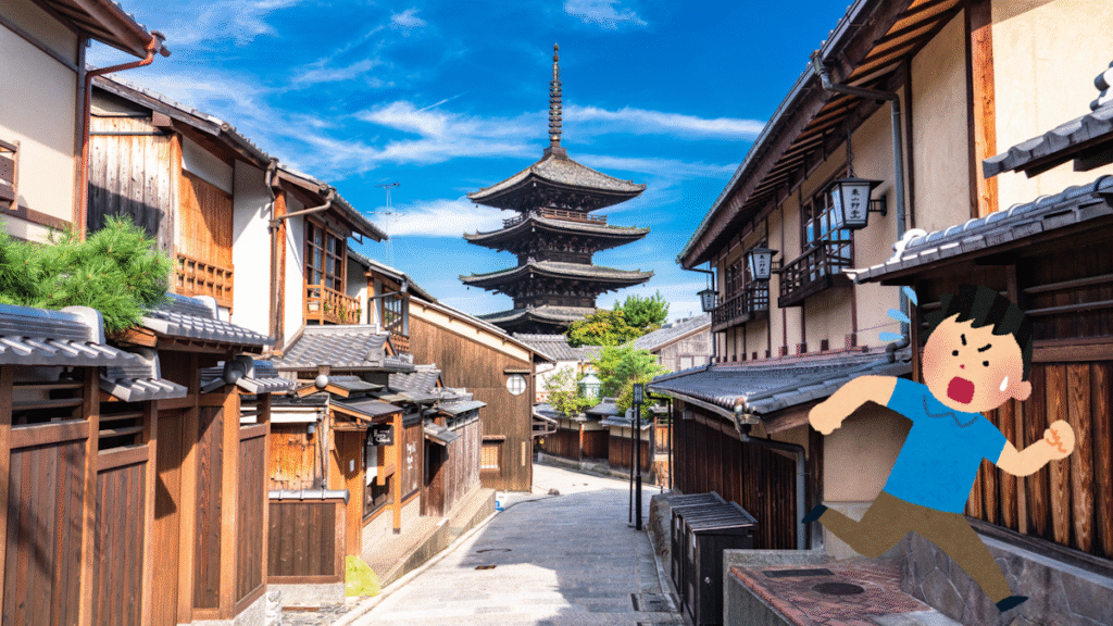 A picture of the street leading up to Hōkanji with an Irasutoya guy running away from it in horror
