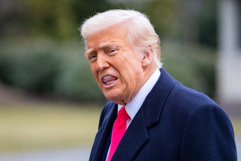 Donald Trump with his tongue sticking out from his teeth