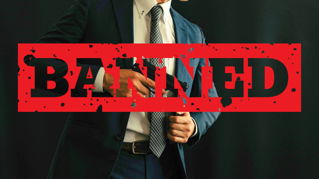 Man in suit pulling out gun from his coat with the word "BANNED" written over him