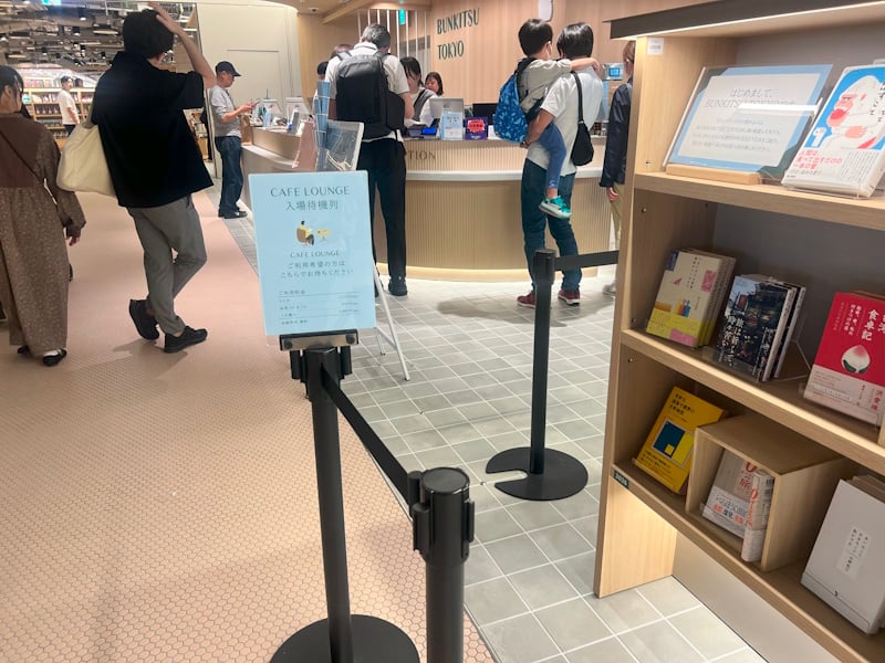 Cafe Lounge inside of Bunkitsu with sign showing cost of admission