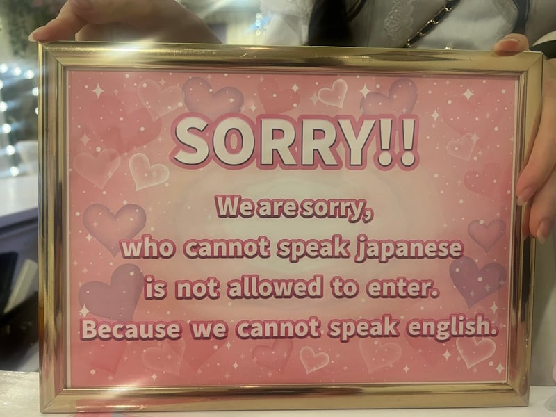 Sing: "Sorry!! We are sorry, who cannot speak japanese is not allowed to enter. Because we cannot speak english." 