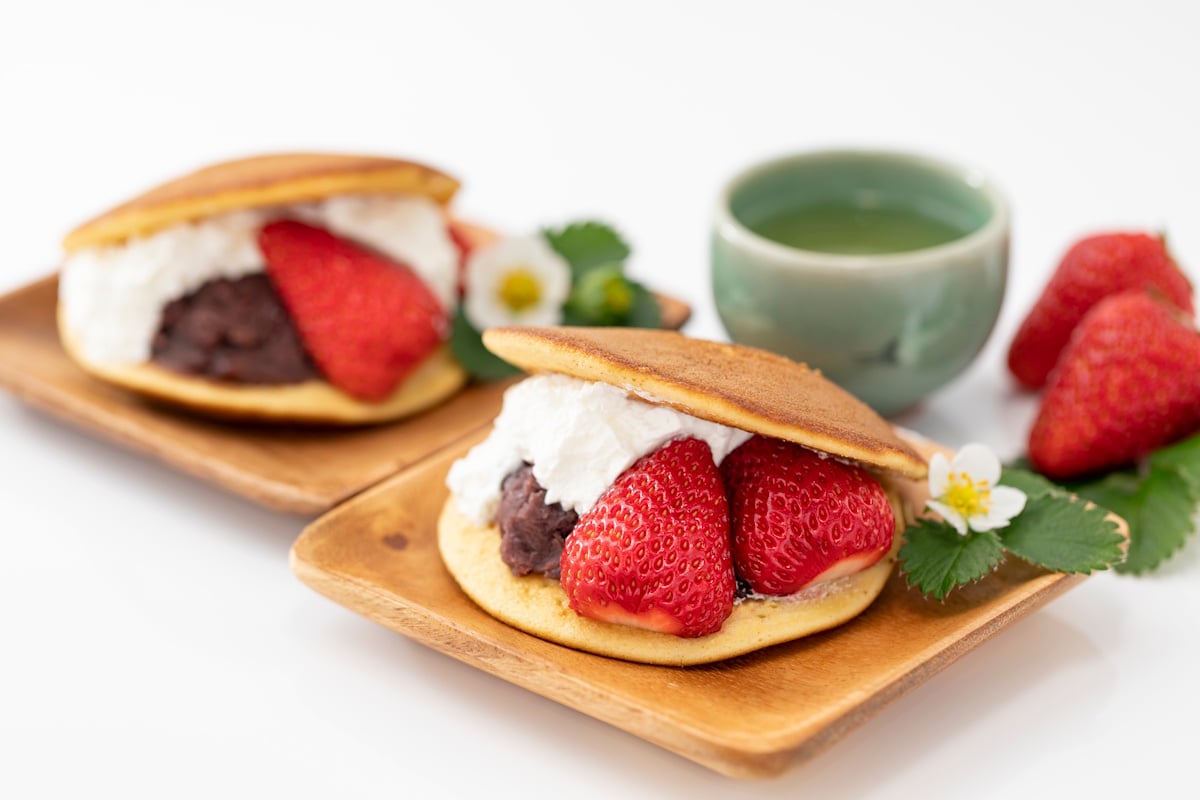 Dorayaki with cream and fresh strawberries, served with green tea