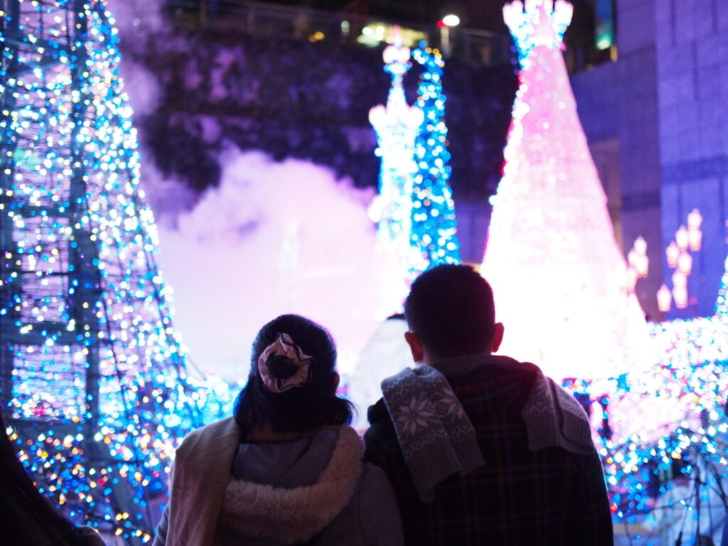 A couple looking at Christmas lights together