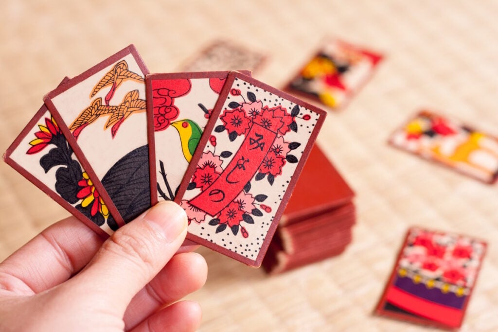 Hanafuda playing cards held in a player's hand