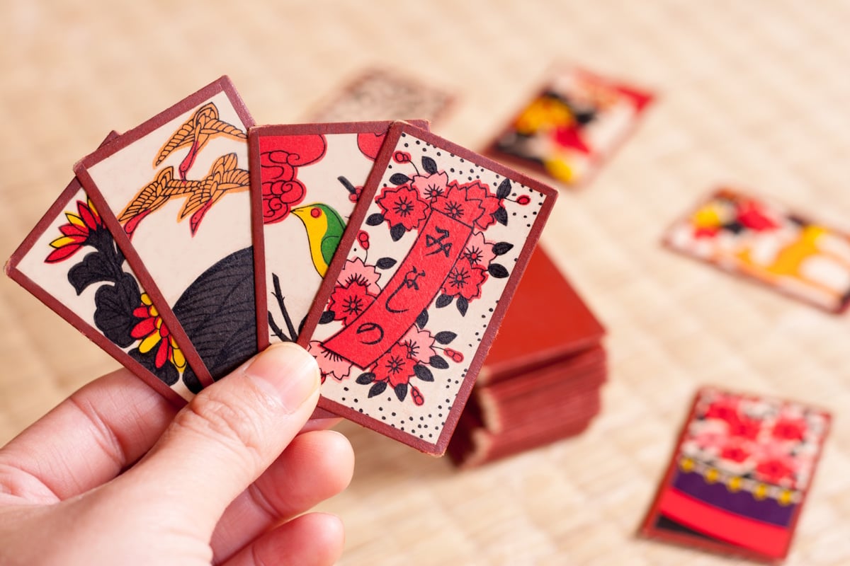 Hanafuda playing cards held in a player's hand