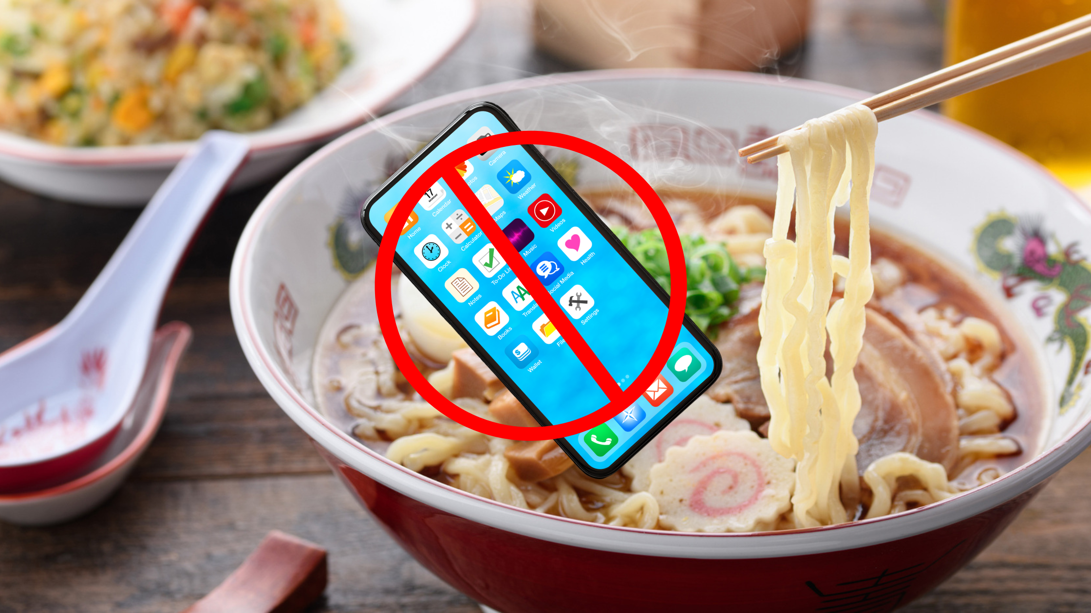 A picture of ramen with a picture of a smartphone and a forbidden symbol overlaid on it