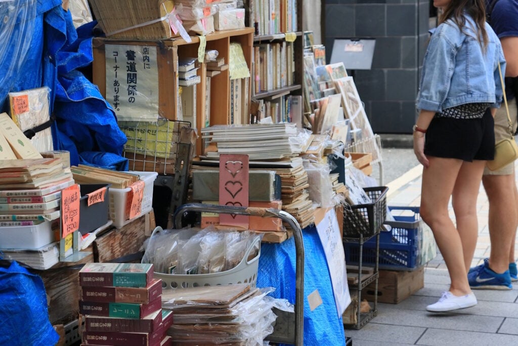 Piles of magazines and zines available for sale in Jimbocho